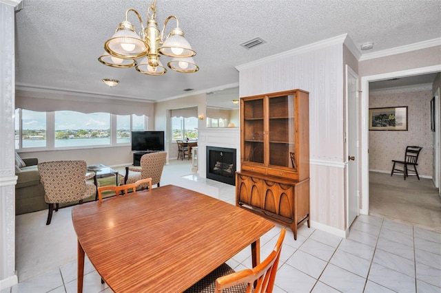 100 Bluff View Dr Unit 511C, Belleair Bluffs, FL 33770 - dining room featuring a chandelier, wallpapered walls, crown molding, light tile patterned floors, and light carpet