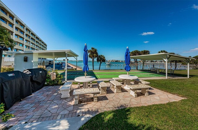 100 Bluff View Dr Unit 511C, Belleair Bluffs, FL 33770 - view of patio featuring shuffleboard and a water view
