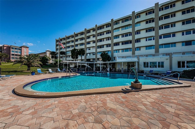 100 Bluff View Dr Unit 511C, Belleair Bluffs, FL 33770 - community pool featuring a patio area