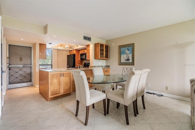 2621 Cove Cay Dr Unit 302, Clearwater, FL 33760 - dining room featuring light tile patterned floors and recessed lighting