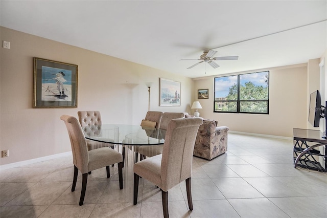 2621 Cove Cay Dr Unit 302, Clearwater, FL 33760 - dining room featuring a ceiling fan and light tile patterned floors
