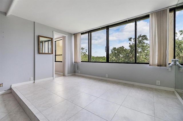 2621 Cove Cay Dr Unit 302, Clearwater, FL 33760 - unfurnished room featuring light tile patterned floors and baseboards