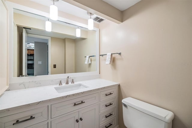 2621 Cove Cay Dr Unit 302, Clearwater, FL 33760 - half bathroom featuring toilet and vanity