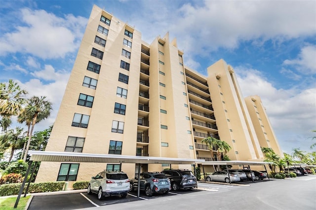 2621 Cove Cay Dr Unit 302, Clearwater, FL 33760 - view of apartment building / complex featuring covered parking
