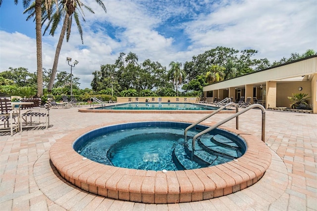 2621 Cove Cay Dr Unit 302, Clearwater, FL 33760 - community pool featuring a patio area and a community hot tub