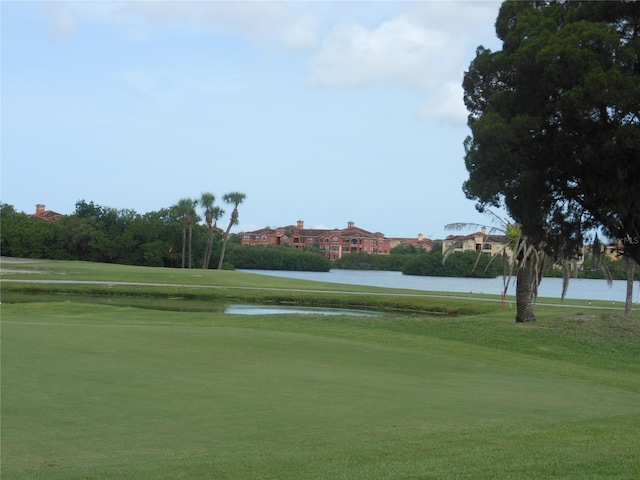 2621 Cove Cay Dr Unit 302, Clearwater, FL 33760 - surrounding community with a water view, a yard, golf course view, and community basketball court