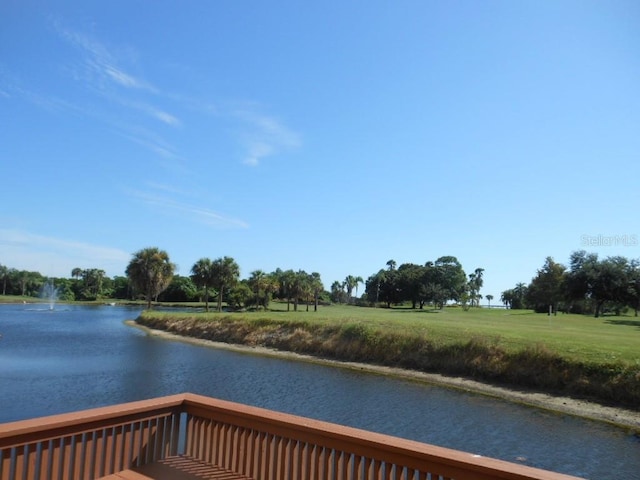 2621 Cove Cay Dr Unit 302, Clearwater, FL 33760 - dock with a water view and a lawn