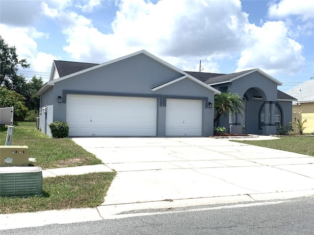 11513 Andy Dr, Riverview, FL 33569 - ranch-style home with a garage, stucco siding, and concrete driveway