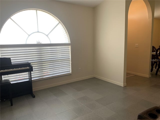 11513 Andy Dr, Riverview, FL 33569 - interior space featuring arched walkways and baseboards