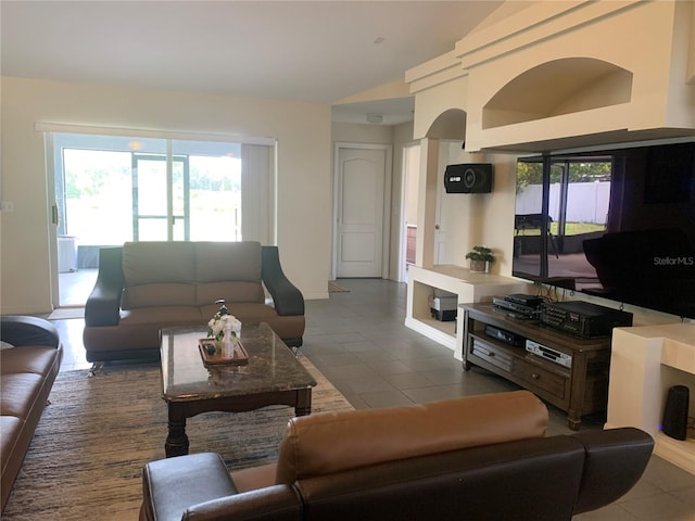11513 Andy Dr, Riverview, FL 33569 - living room with vaulted ceiling and tile patterned flooring