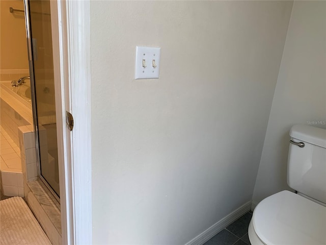 11513 Andy Dr, Riverview, FL 33569 - full bathroom featuring tile patterned floors, toilet, a shower with shower door, a bath, and baseboards