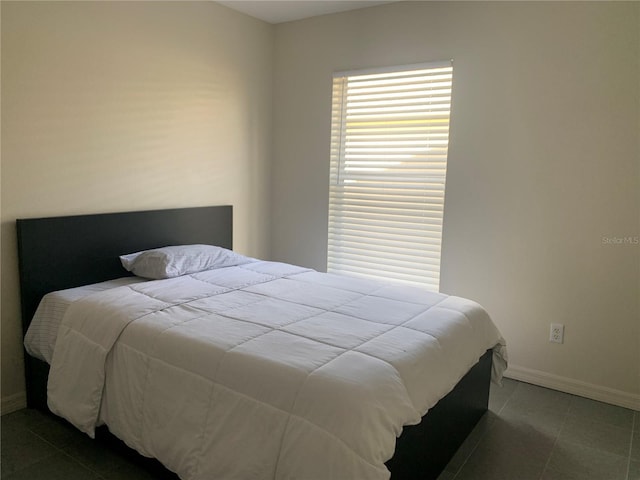 11513 Andy Dr, Riverview, FL 33569 - tiled bedroom featuring baseboards