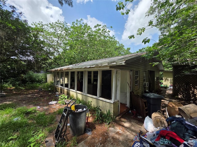 5800 SE 33rd Ave, Ocala, FL 34480 - view of property exterior featuring a sunroom