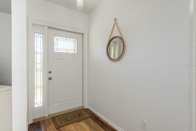 630 Kirkland Cir, Dunedin, FL 34698 - entryway with wood finished floors and baseboards