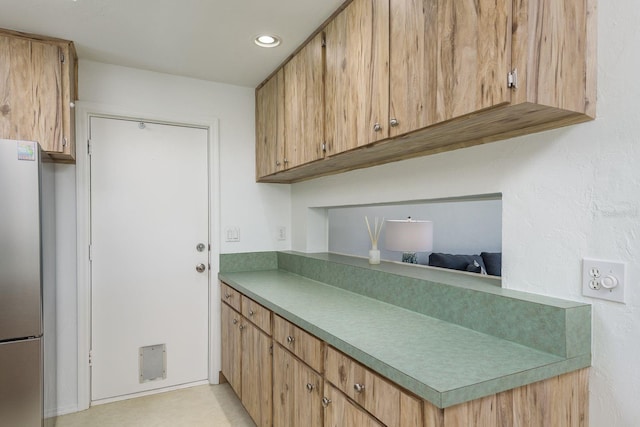 630 Kirkland Cir, Dunedin, FL 34698 - kitchen with freestanding refrigerator, recessed lighting, and light countertops