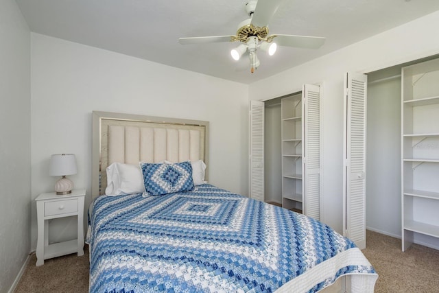 630 Kirkland Cir, Dunedin, FL 34698 - carpeted bedroom featuring a ceiling fan and two closets
