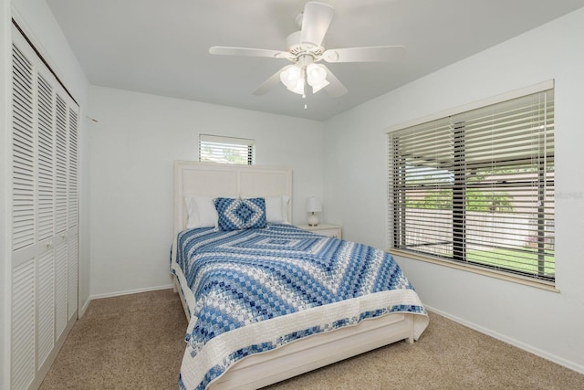 630 Kirkland Cir, Dunedin, FL 34698 - bedroom with carpet floors, a closet, and ceiling fan