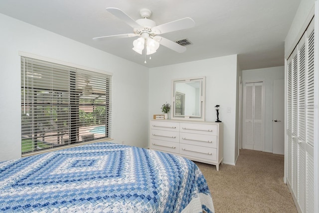 630 Kirkland Cir, Dunedin, FL 34698 - bedroom featuring light carpet and a ceiling fan