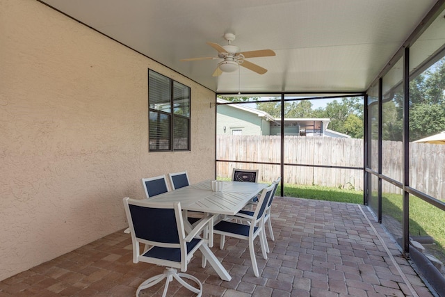 630 Kirkland Cir, Dunedin, FL 34698 - sunroom featuring a ceiling fan and outdoor dining space