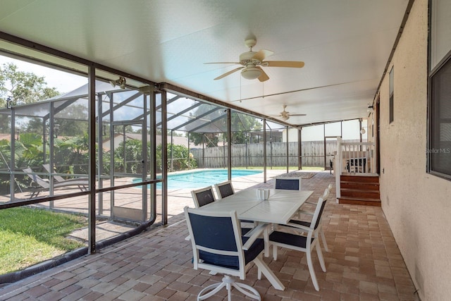 630 Kirkland Cir, Dunedin, FL 34698 - sunroom featuring ceiling fan, healthy amount of natural light, and outdoor dining area