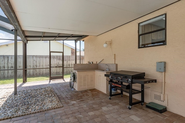 630 Kirkland Cir, Dunedin, FL 34698 - view of patio / terrace with area for grilling, washer / clothes dryer, and a lanai