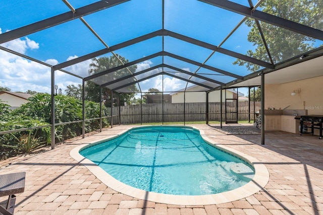 630 Kirkland Cir, Dunedin, FL 34698 - view of swimming pool with a patio, glass enclosure, and a grill