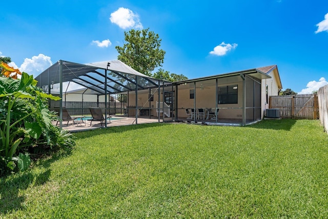 630 Kirkland Cir, Dunedin, FL 34698 - rear view of house with a patio area, a fenced backyard, ceiling fan, and a lanai