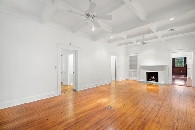 1400 Cherry St NE, Saint Petersburg, FL 33704 - unfurnished living room with a ceiling fan, light wood finished floors, coffered ceiling, beamed ceiling, and baseboards