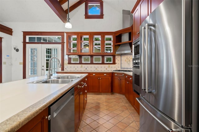 1400 Cherry St NE, Saint Petersburg, FL 33704 - kitchen with appliances with stainless steel finishes, a sink, light countertops, tasteful backsplash, and lofted ceiling