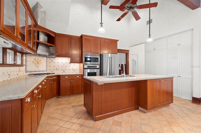 1400 Cherry St NE, Saint Petersburg, FL 33704 - kitchen with high vaulted ceiling, appliances with stainless steel finishes, a ceiling fan, a sink, and backsplash