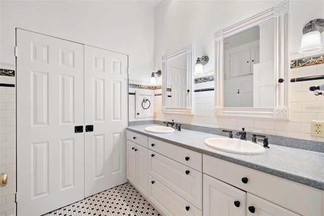 1400 Cherry St NE, Saint Petersburg, FL 33704 - bathroom with double vanity and decorative backsplash