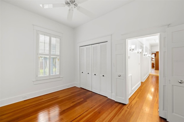 1400 Cherry St NE, Saint Petersburg, FL 33704 - unfurnished bedroom with light wood finished floors, baseboards, and a closet