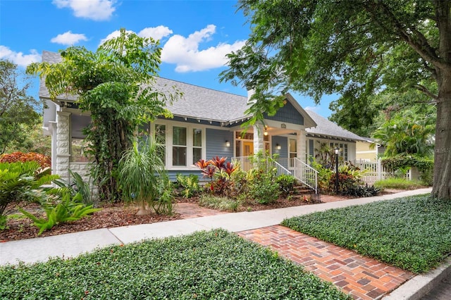 1400 Cherry St NE, Saint Petersburg, FL 33704 - bungalow-style home featuring a porch and a shingled roof