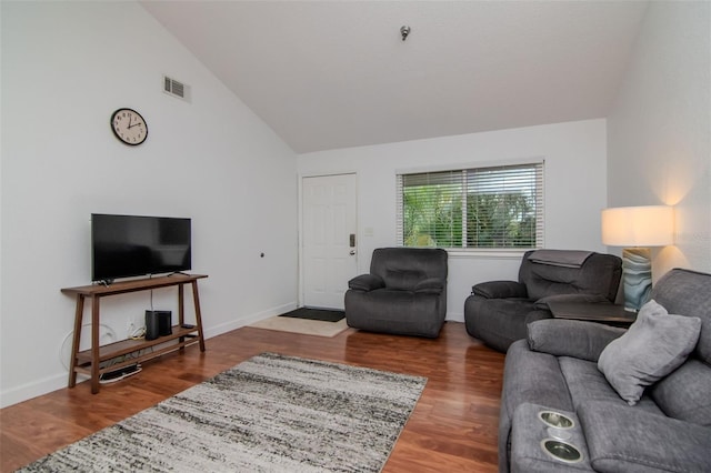 10265 Gandy Blvd N Unit 1702, Saint Petersburg, FL 33702 - living area featuring wood finished floors, baseboards, and high vaulted ceiling