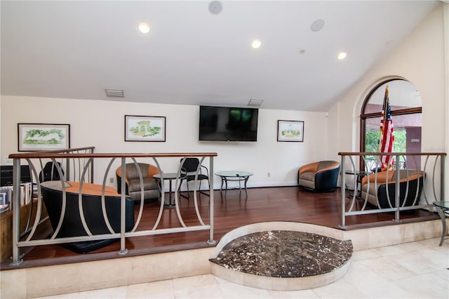 10265 Gandy Blvd N Unit 1702, Saint Petersburg, FL 33702 - living room featuring vaulted ceiling, recessed lighting, baseboards, and wood finished floors