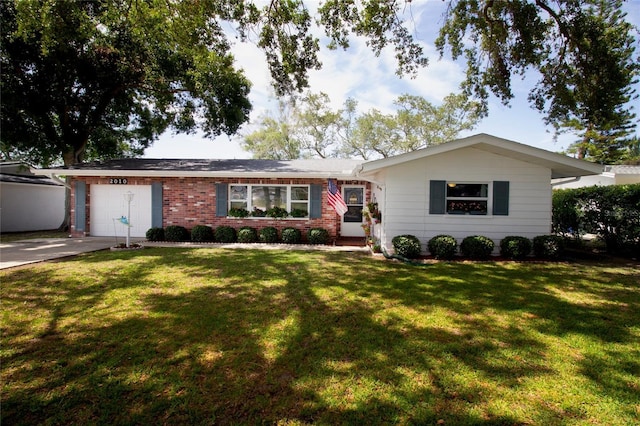 2010 6th Ave SW, Largo, FL 33770 - ranch-style home featuring a garage, concrete driveway, a front yard, and brick siding