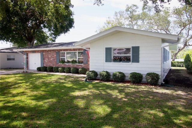 2010 6th Ave SW, Largo, FL 33770 - view of front of house featuring a garage, a front yard, and brick siding