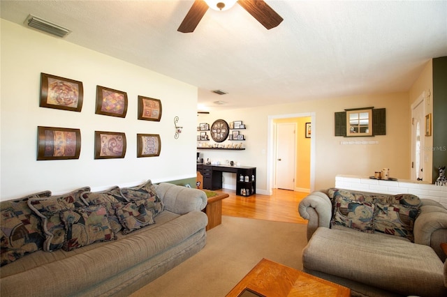 2010 6th Ave SW, Largo, FL 33770 - living room featuring a ceiling fan and light carpet