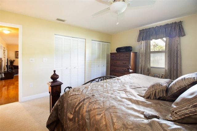 2010 6th Ave SW, Largo, FL 33770 - bedroom with multiple closets, carpet, a ceiling fan, and baseboards