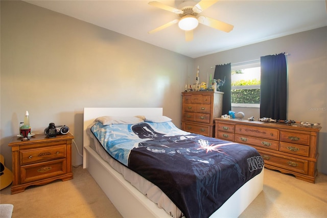 2010 6th Ave SW, Largo, FL 33770 - bedroom with light carpet and a ceiling fan