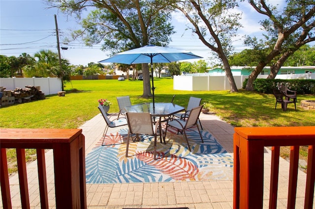 2010 6th Ave SW, Largo, FL 33770 - wooden terrace with outdoor dining space and a patio area