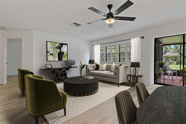 1401 Camelot Ct, Palm Harbor, FL 34684 - living area featuring light wood-style floors, a textured ceiling, and ceiling fan