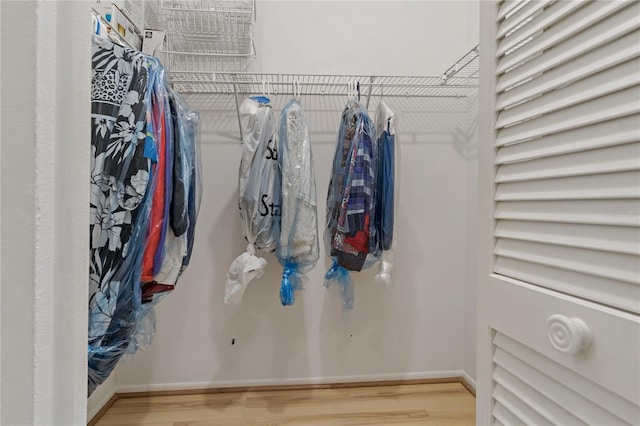 1401 Camelot Ct, Palm Harbor, FL 34684 - spacious closet featuring wood finished floors