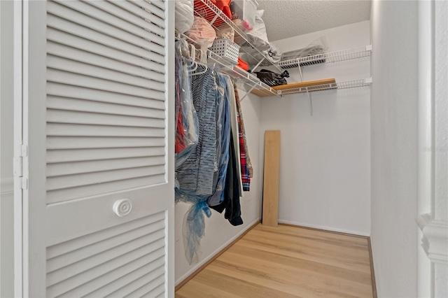 1401 Camelot Ct, Palm Harbor, FL 34684 - spacious closet featuring wood finished floors