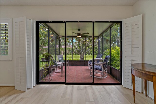 1401 Camelot Ct, Palm Harbor, FL 34684 - entryway with a ceiling fan and wood finished floors
