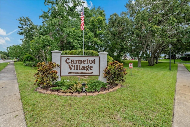 1401 Camelot Ct, Palm Harbor, FL 34684 - community sign with a lawn