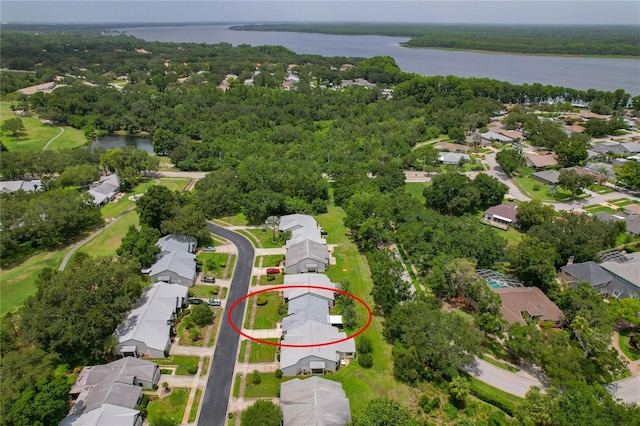 1401 Camelot Ct, Palm Harbor, FL 34684 - aerial view of property and surrounding area featuring a large body of water and nearby suburban area