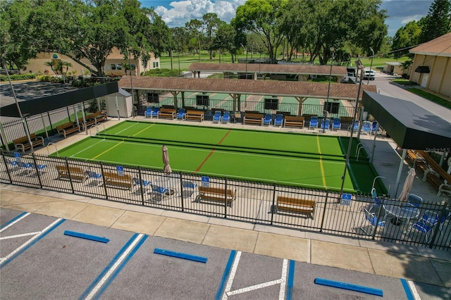 1401 Camelot Ct, Palm Harbor, FL 34684 - view of home's community with uncovered parking and a bocce ball area