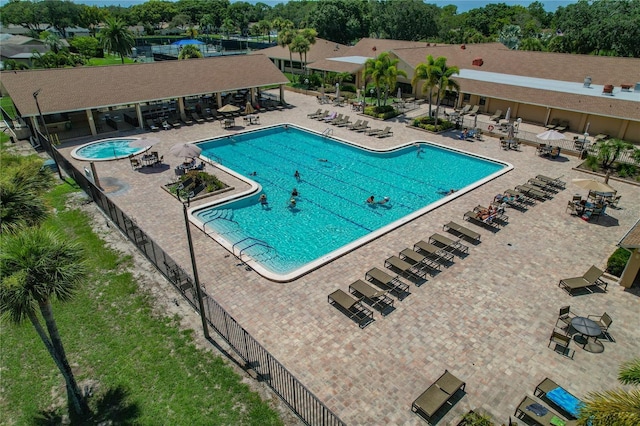 1401 Camelot Ct, Palm Harbor, FL 34684 - community pool with a patio and a water view