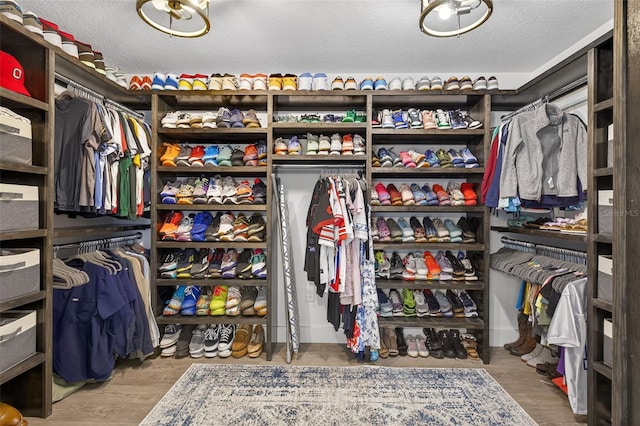 7570 Sweeter Tide Trl, Wesley Chapel, FL 33545 - spacious closet featuring wood finished floors